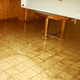 The murk the water left behind after the second 1989 flood. The ashy color of the wood at the bottom of the table reflects that it was submerged for a long time—and now ruined.
